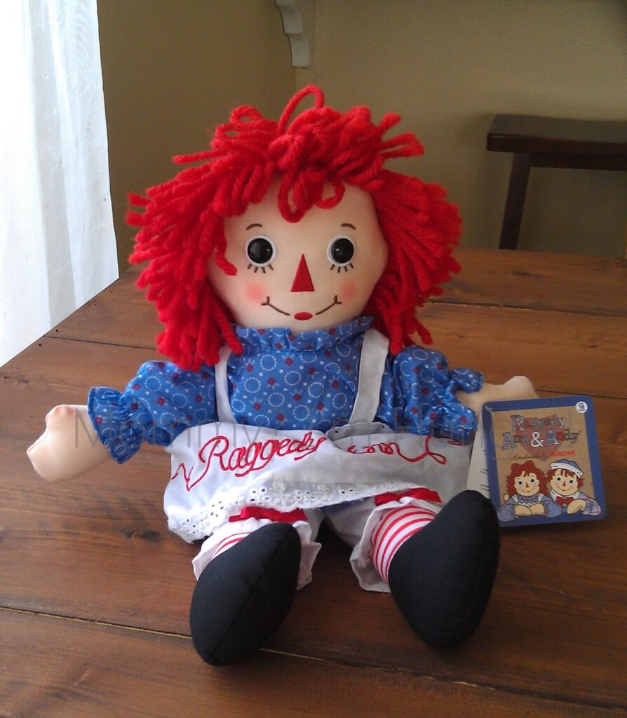 A photo of a Raggedy Ann doll.